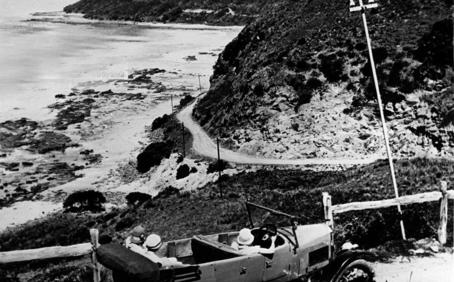 Old Car Rounding Bend On Great Ocean Road 1768438708